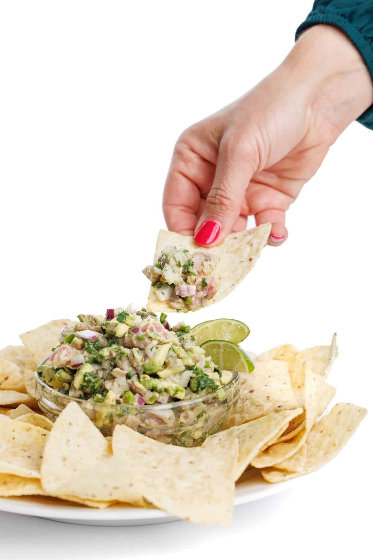 Chip scooping fresh and flavorful ahi tuna ceviche.