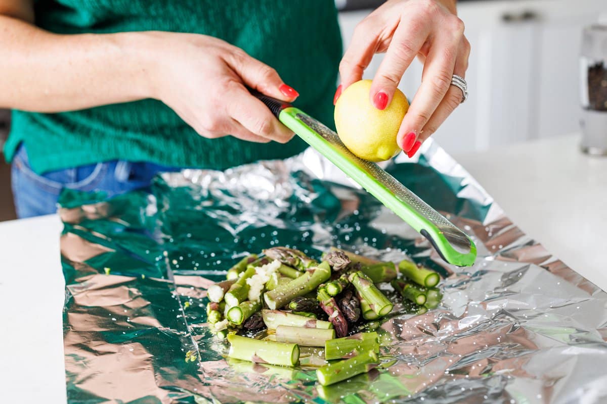 Liz zesting lemon over asparagus.
