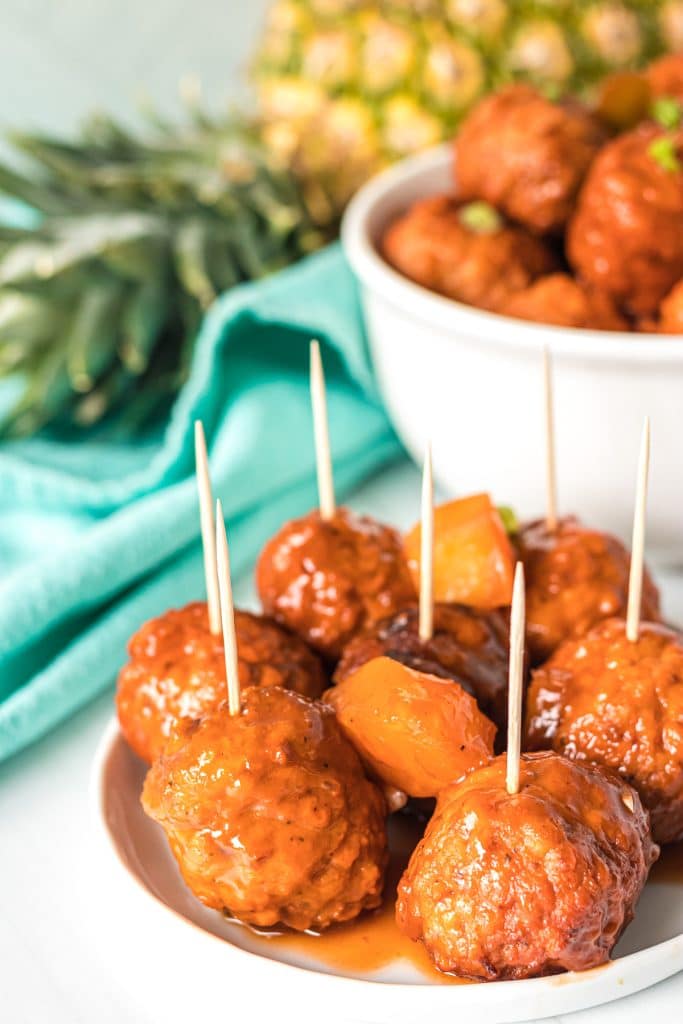 hawaiian meatballs with toothpicks stuck into each.