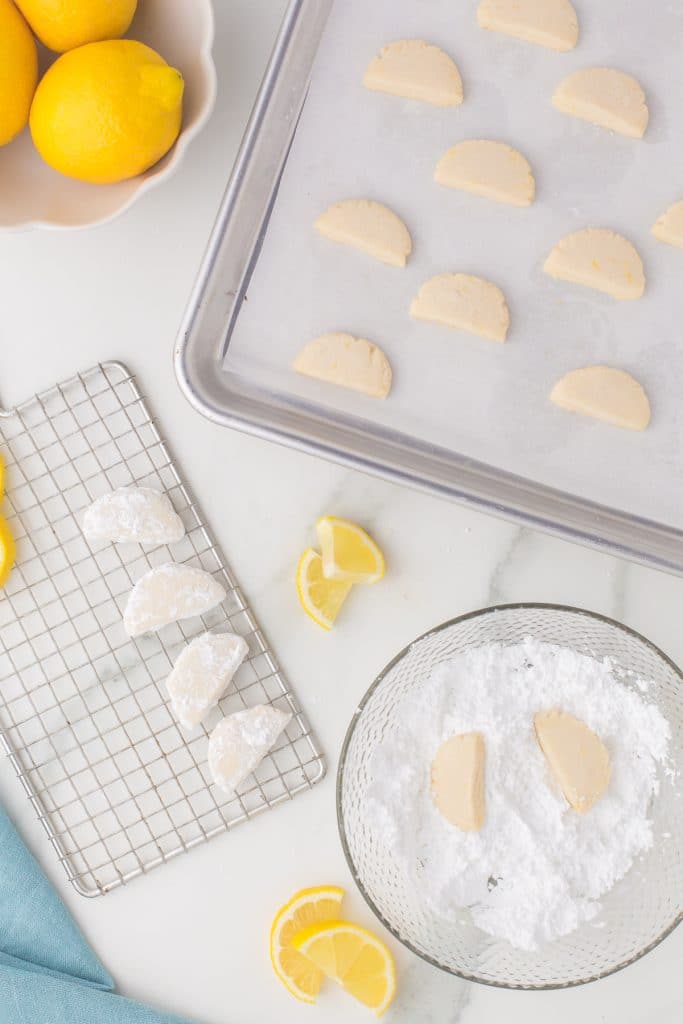 overhead shot of lemon powder sugar cookies on a wire rack.