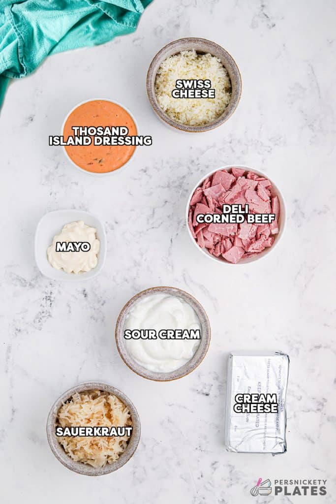 overhead shot of labeled ingredients laid out to make reuben dip.
