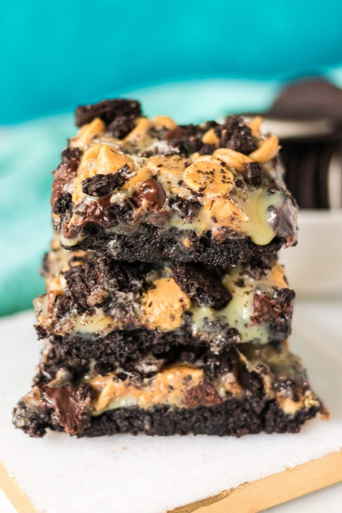stack of 3 oreo magic bars on a white stone.