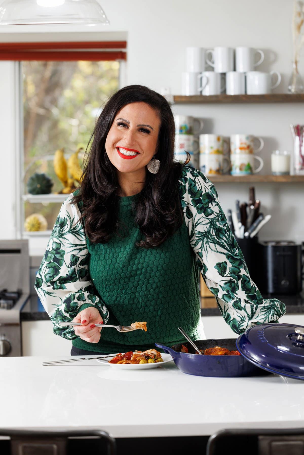 Liz eating braised chicken thighs.
