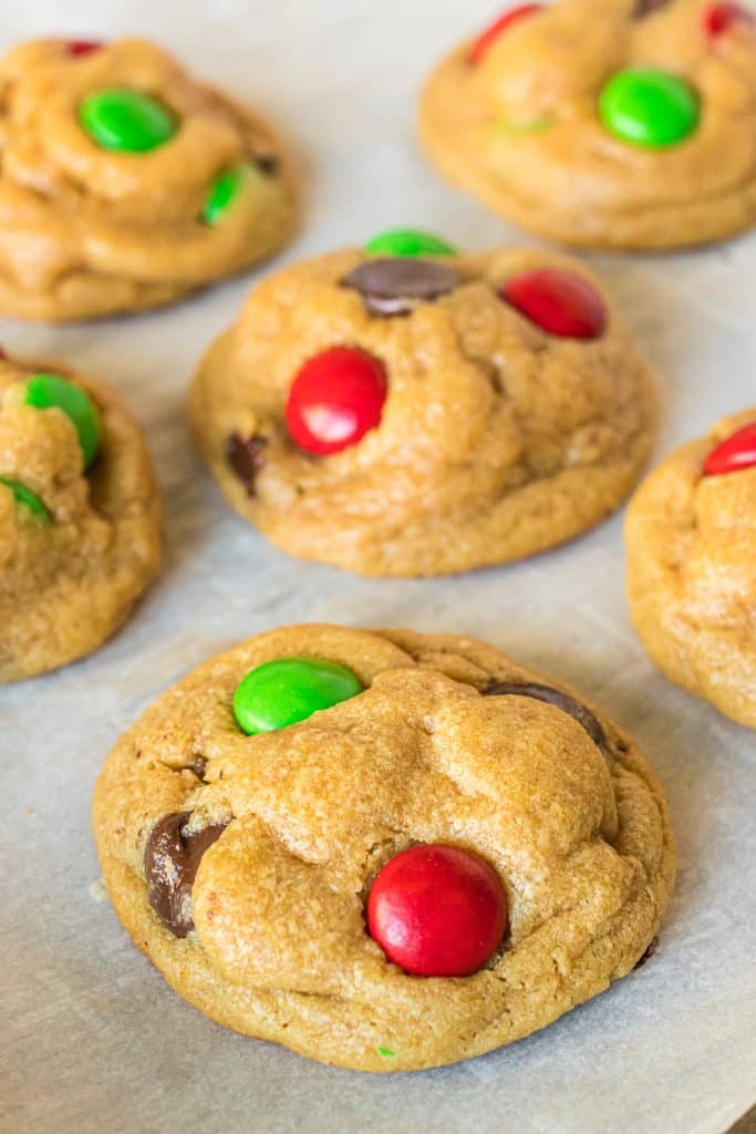 closeup of christmas chocolate chip cookies on a baking sheet.