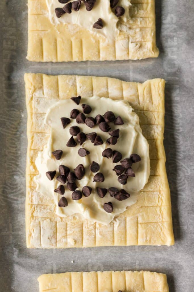 closeup of mini chocolate chips sprinkled on cream cheese filling.