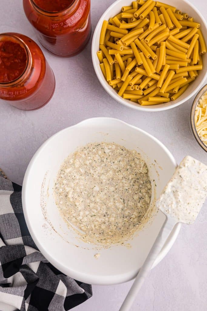overhead shot of a cottage cheese mixture in a white bowl.