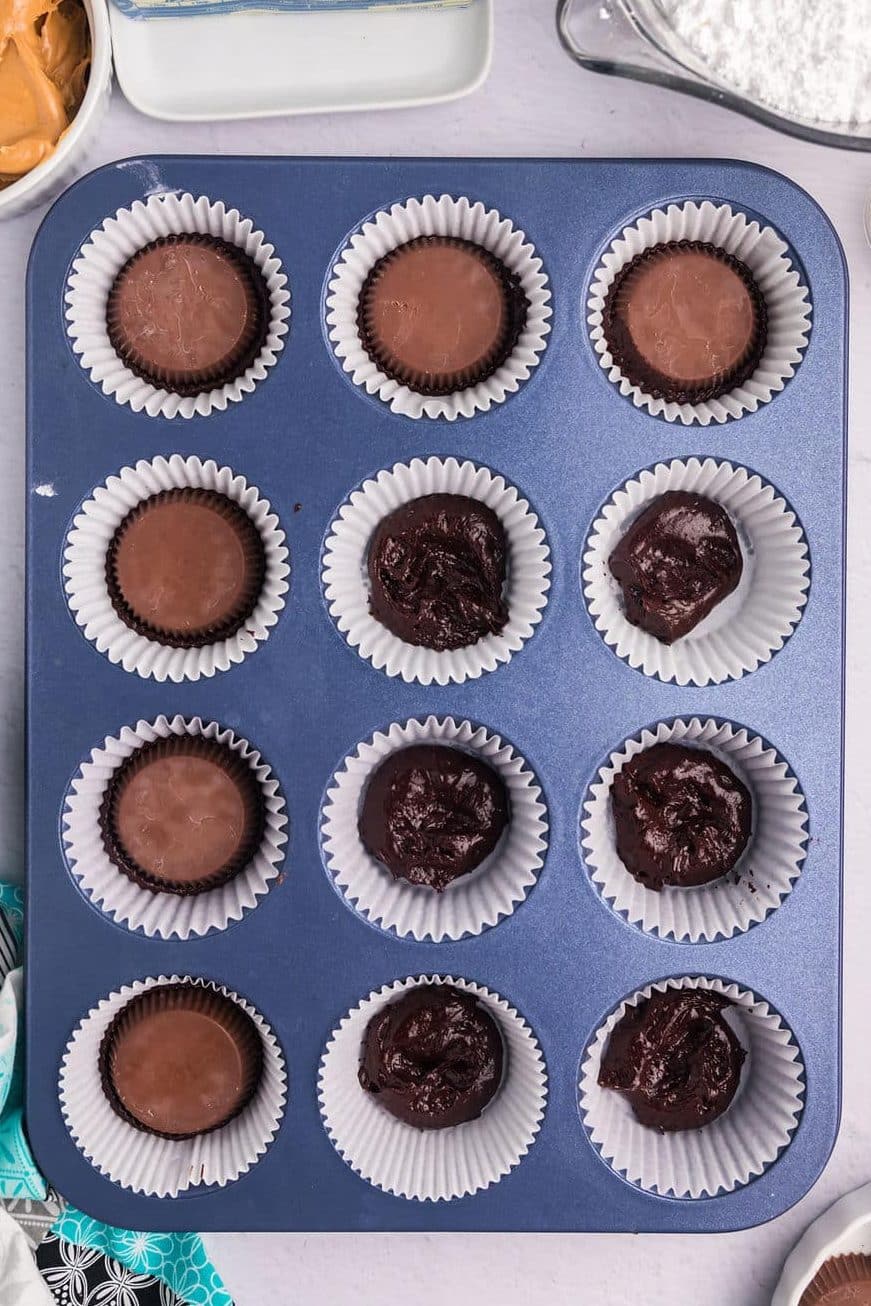 overhead shot of a cupcake pan with chocolate batter.