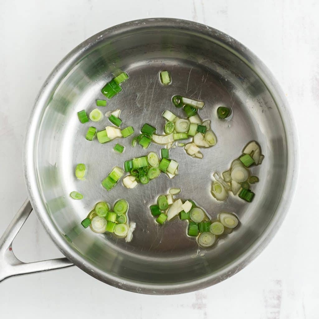 saucepan will green onions.