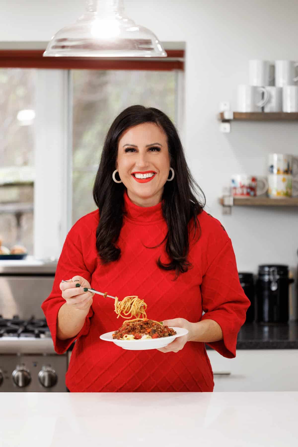 Liz eating ground turkey bolognese.