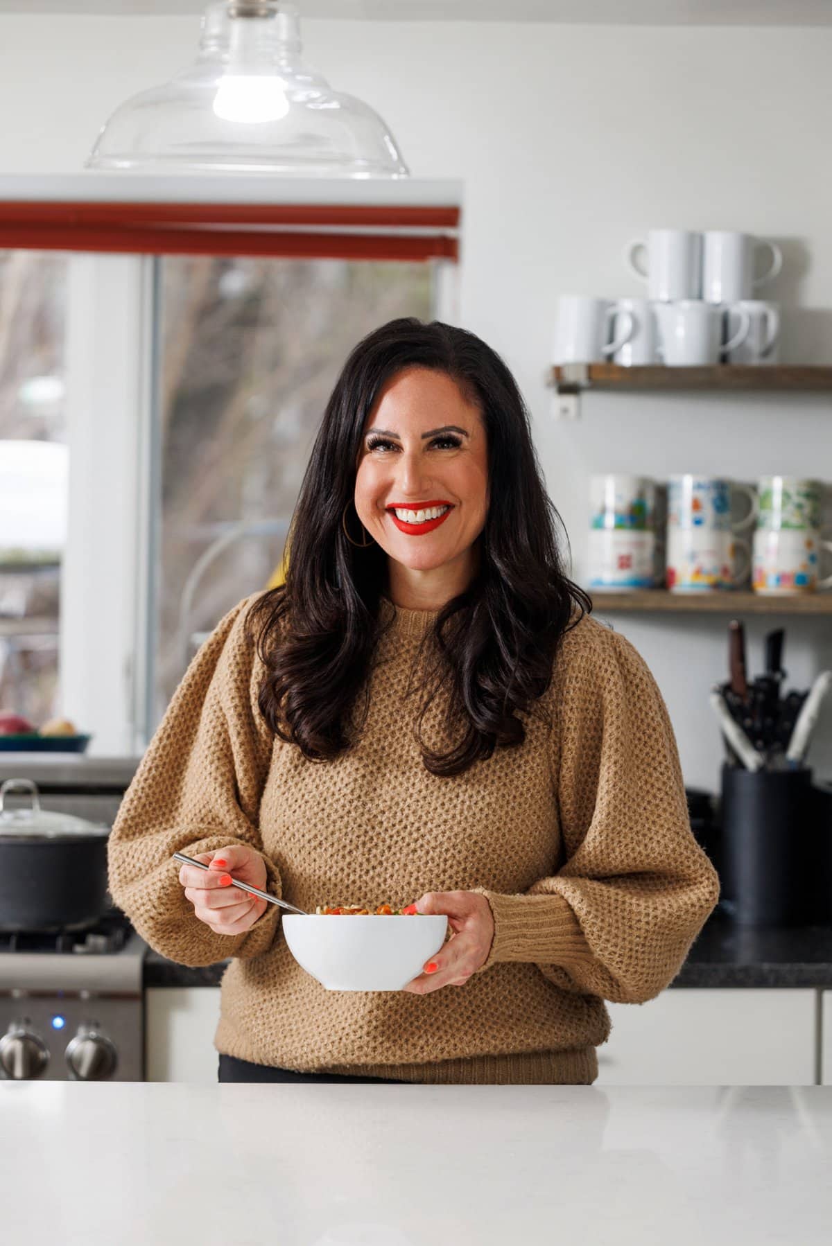 Liz eating chicken and sausage jambalaya soup.