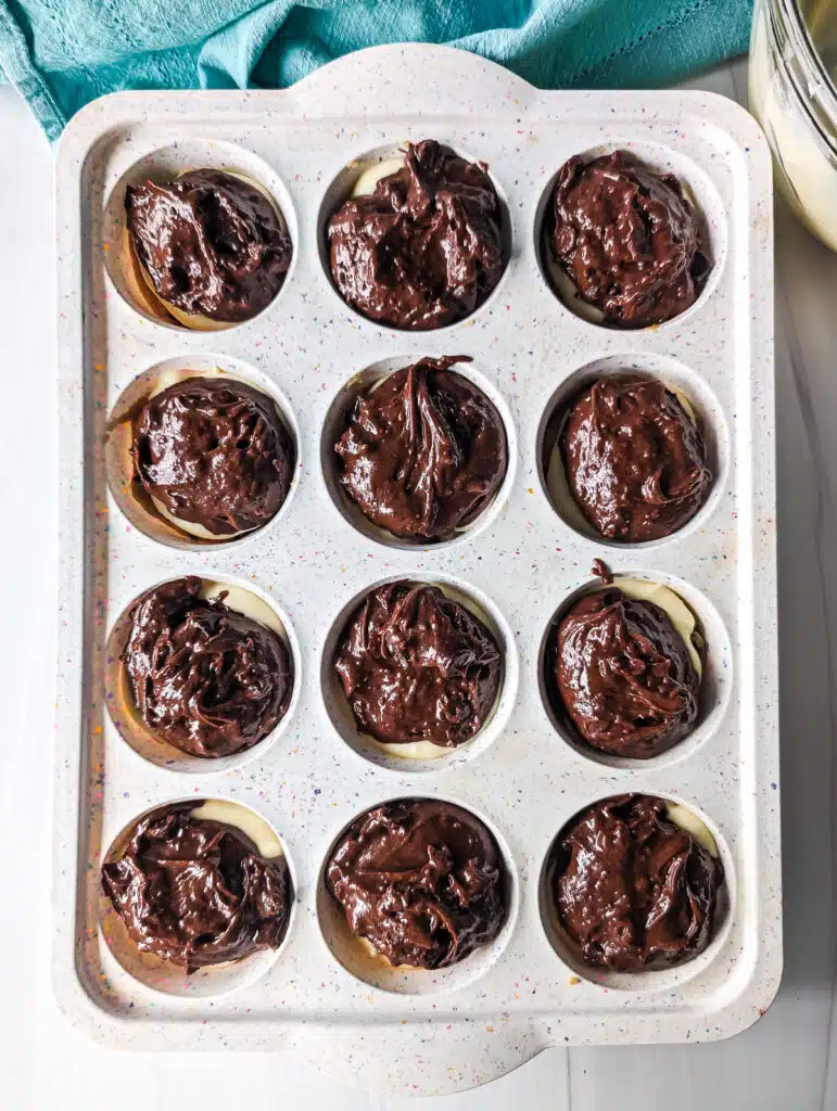 overhead shot of brownie batter in a cupcake pan.