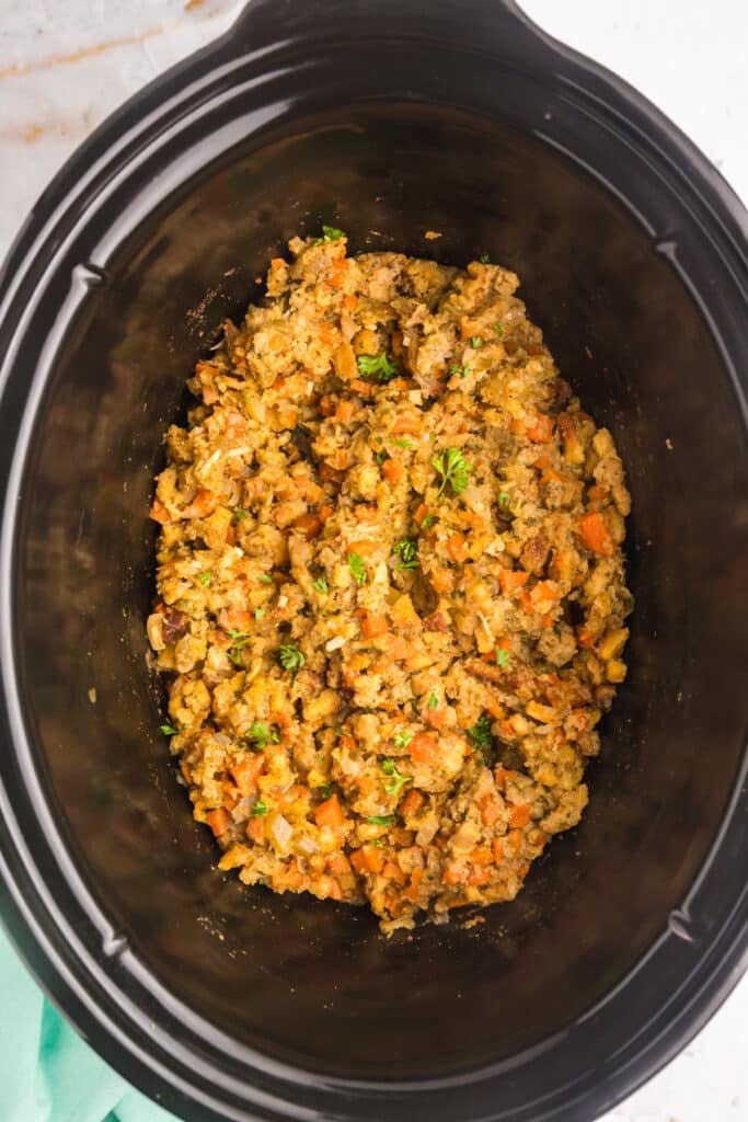 overhead shot of prepared stuffing in a crockpot.