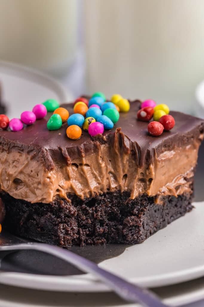 slice of brownie lush with a bite missing.