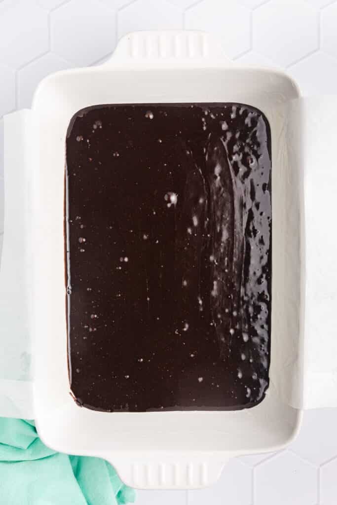 prepared brownie mix poured into a baking dish.