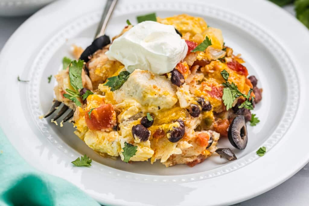 chicken enchilada casserole on a white plate.