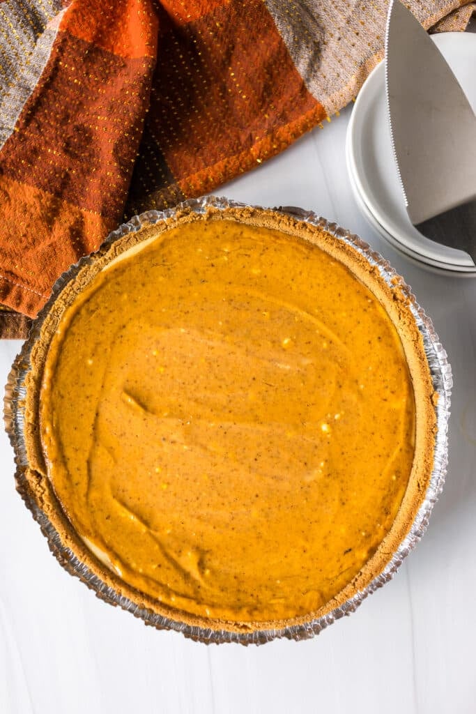 overhead shot of a baked pumpkin pie cheesecake.