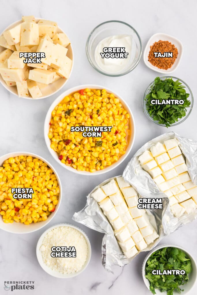 overhead shot of labeled ingredients laid out to make corn dip.