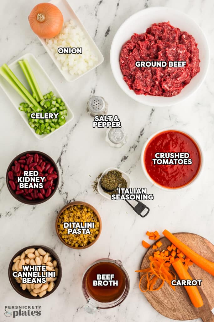 overhead shot of labeled ingredients laid out to make pasta fagioli soup.