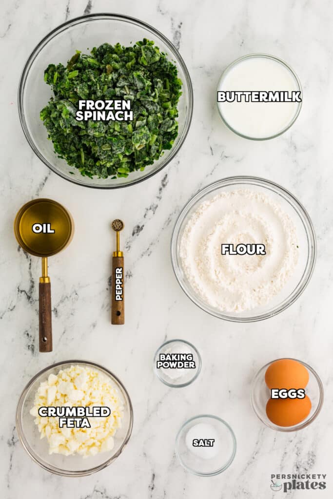 overhead shot of labeled ingredients laid out to make spinach feta quick bread.