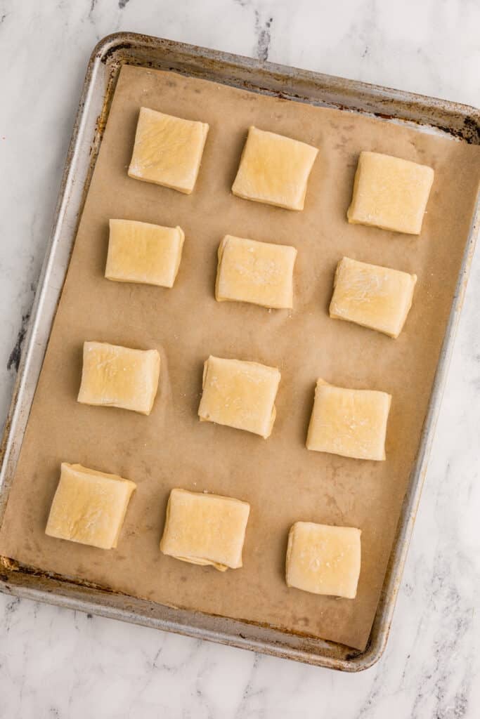 12 rolls on a baking sheet.