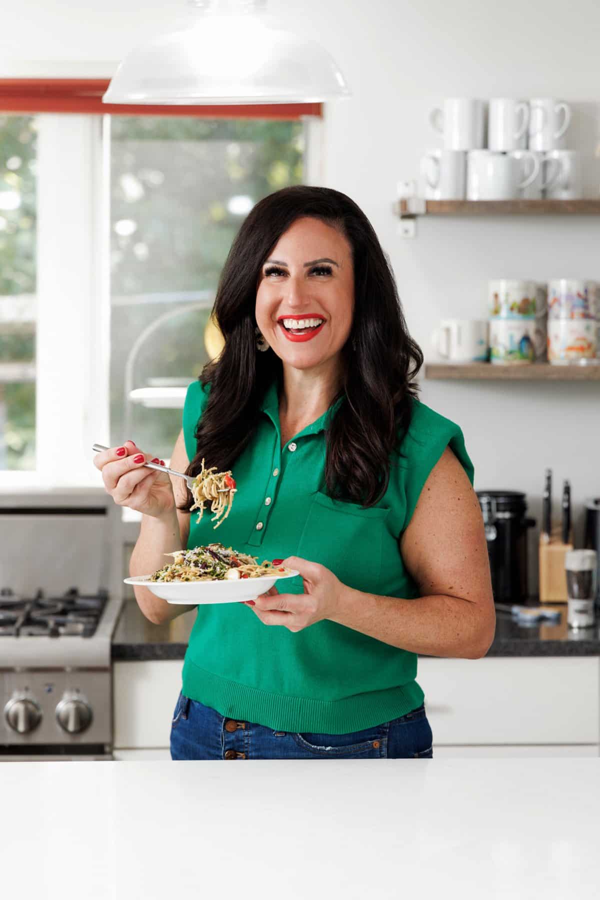 Liz eating Garlic Roasted Vegetable Pasta.