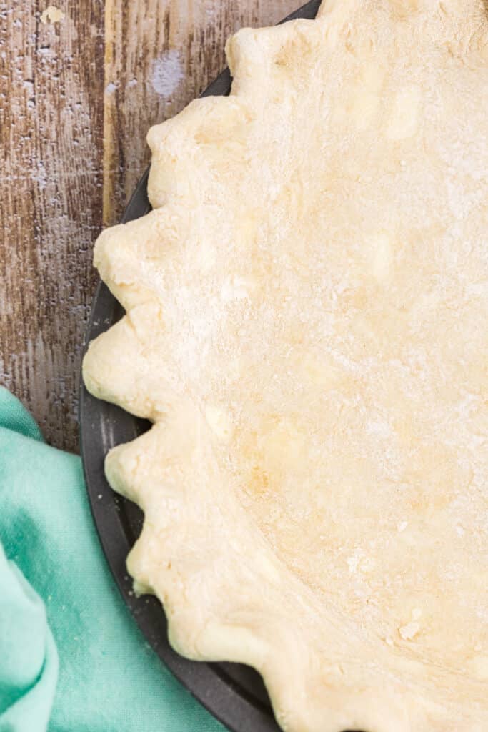 closeup overhead shot of butter pie crust in a plate.