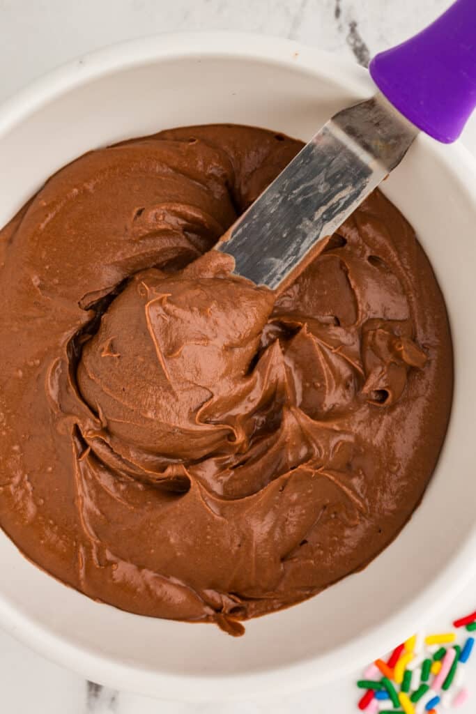 chocolate frosting on a spatula.