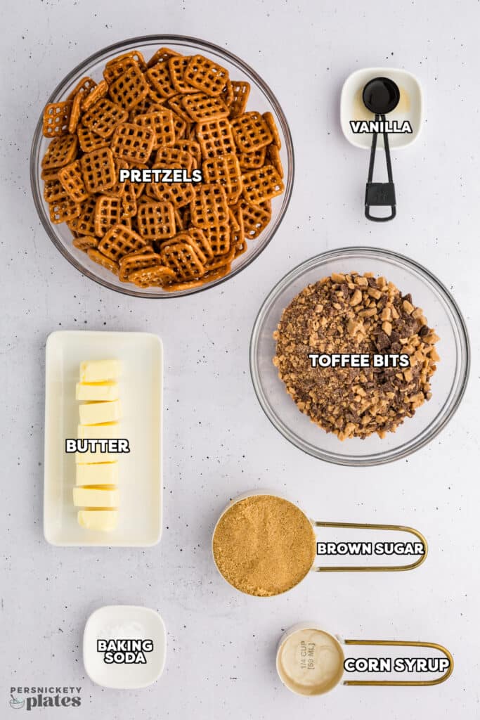 Ingredients for butter toffee pretzels labeled in bowls.