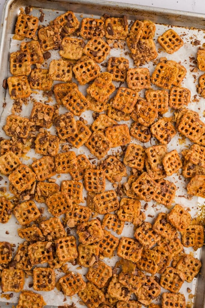 Butter toffee pretzels on a baking sheet.