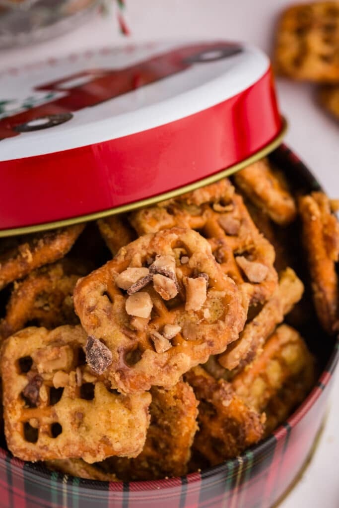 Butter toffee pretzels in a decorative tin.