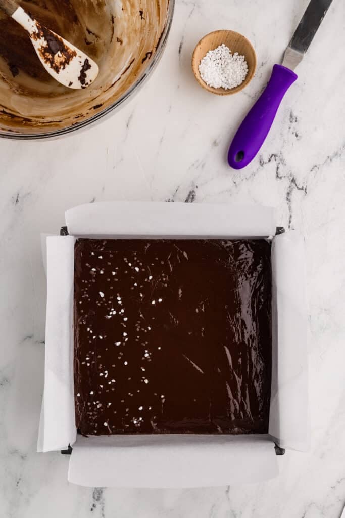 Finished fudge in a pan with salt topping.