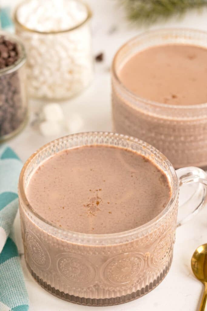 Top view of glass mugs filled with smooth hot chocolate.