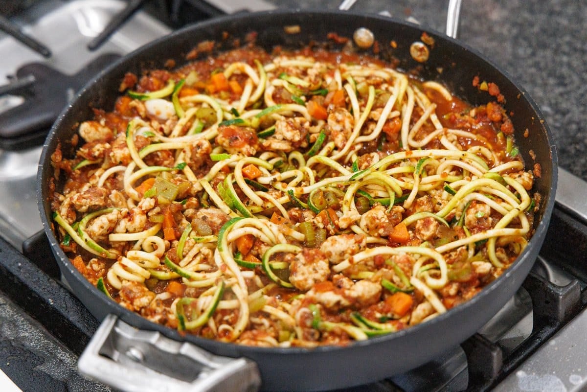 Cooked zoodles in bolognese sauce.