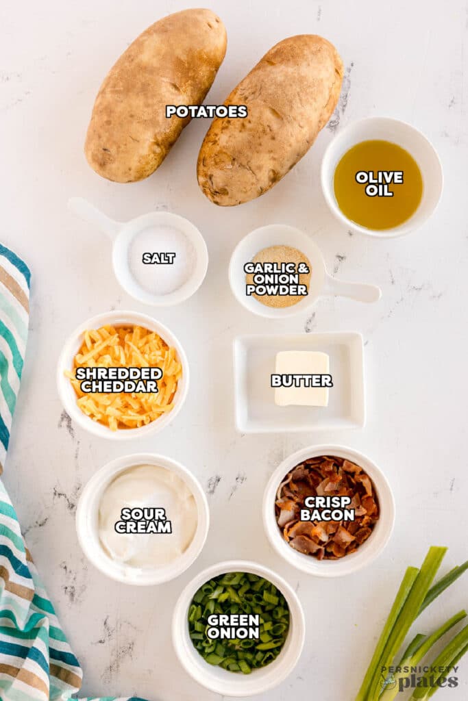 overhead shot of labeled ingredients laid out to make twice baked potatoes.