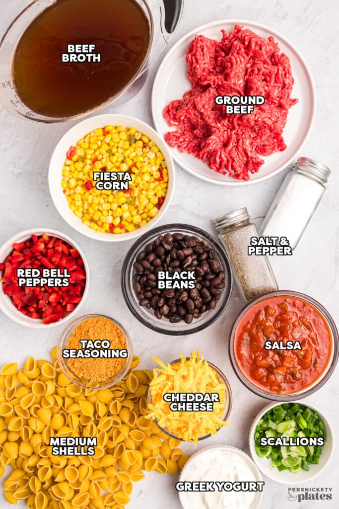 overhead shot of labeled ingredients laid out to make taco pasta.