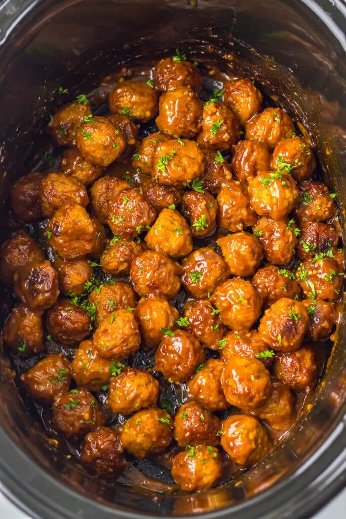 overhead shot of meatballs garnished with parsley.