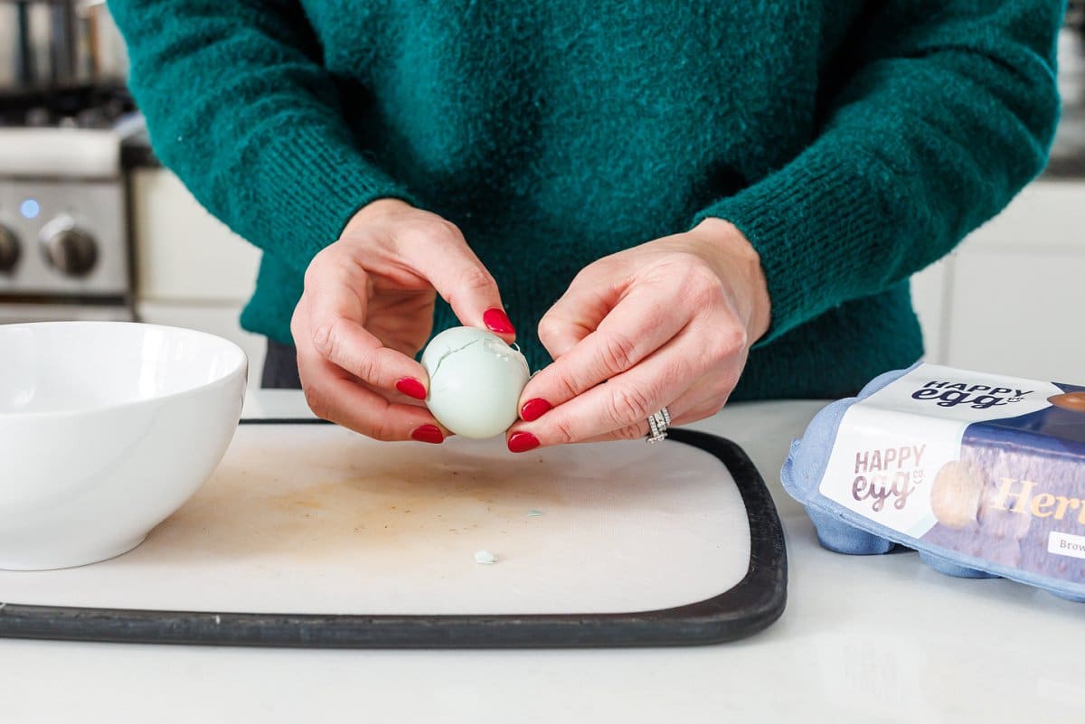 Liz peeling an egg.