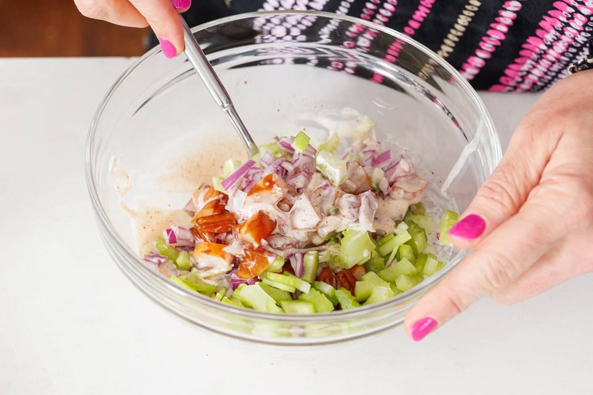 Shrimp salad ingredients in bowl.