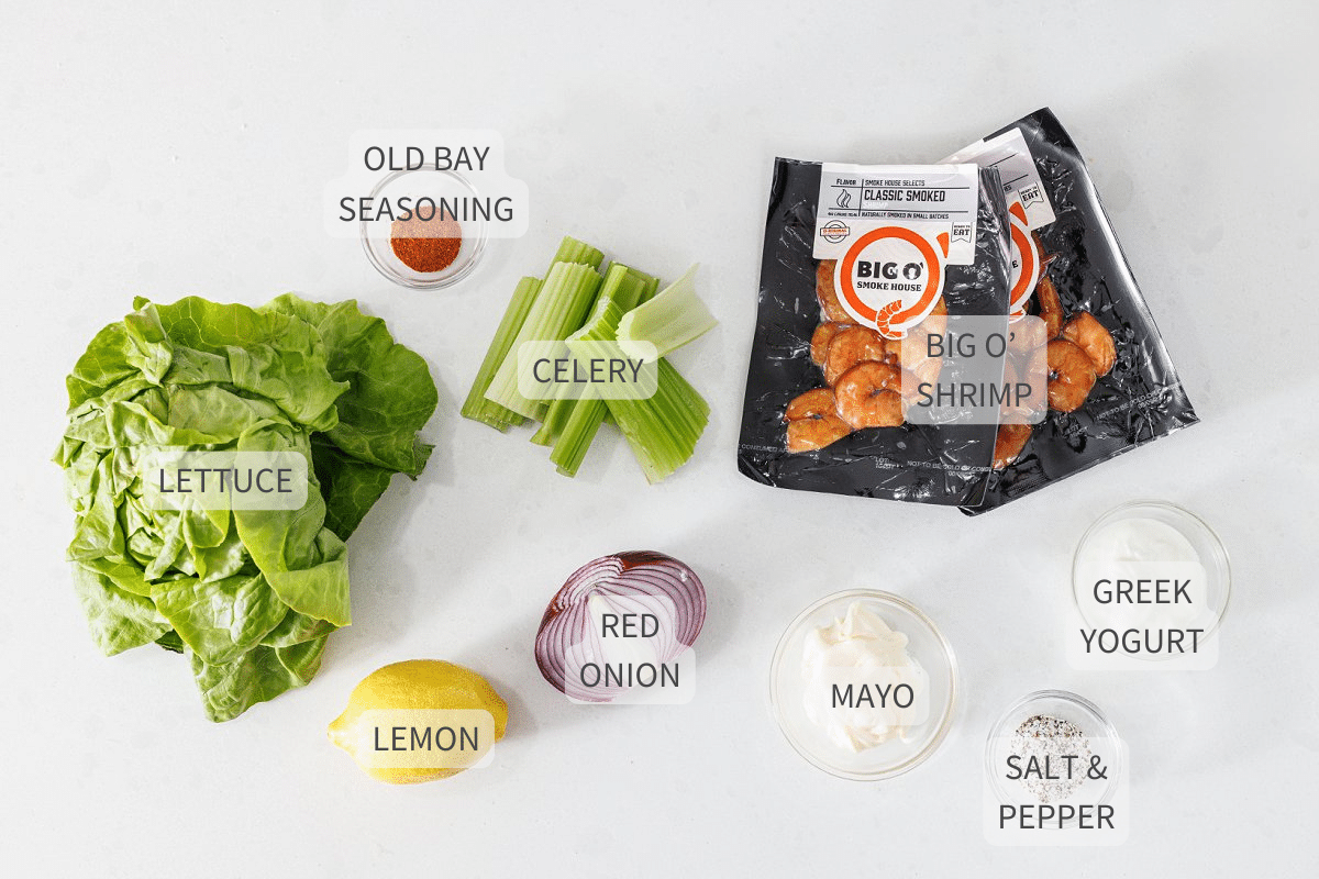 Labeled ingredients for shrimp salad lettuce cups against a white background.