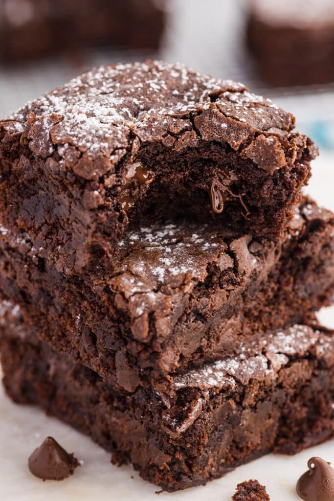 Stack of fudgy chocolate brownies with a melted chocolate center.