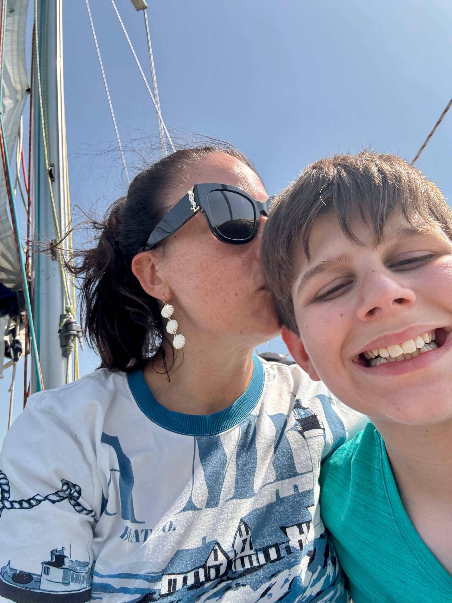 Liz and one of her sons enjoying a sailing tour on the Tagus river.