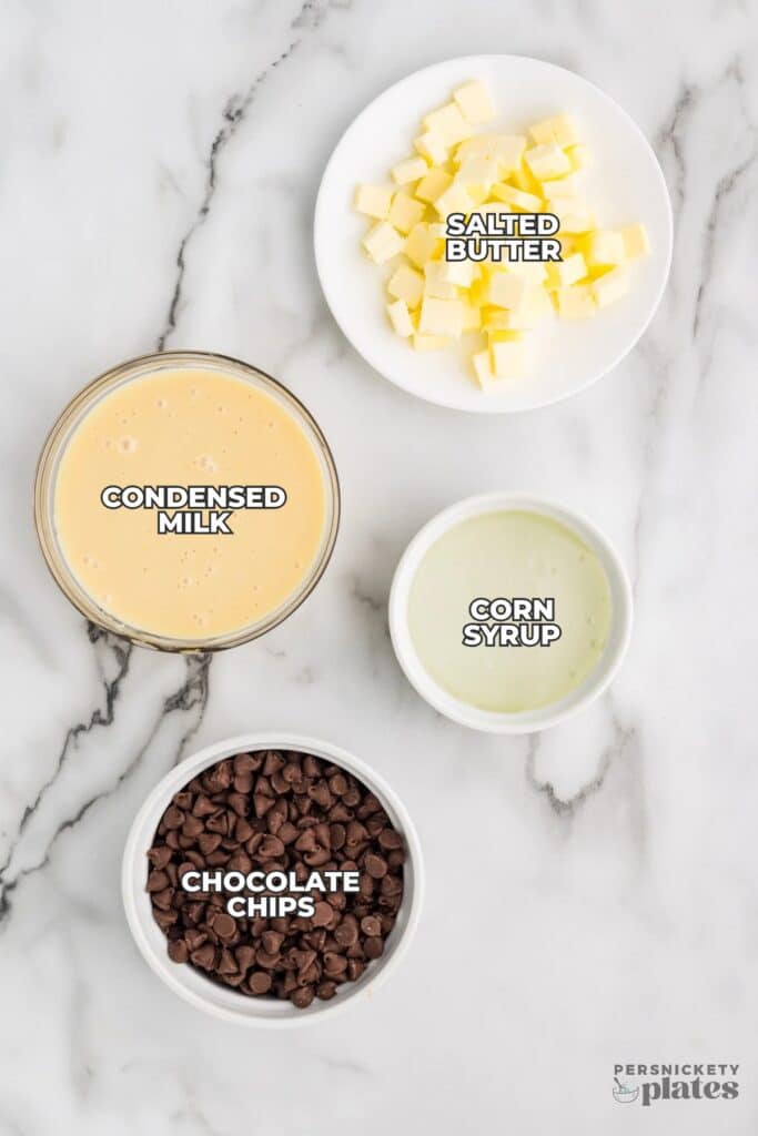 hot fudge ingredients on a white marble surface.