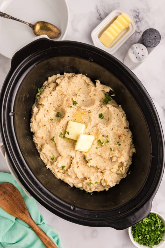 Mashed potatoes with butter in a slow cooker.