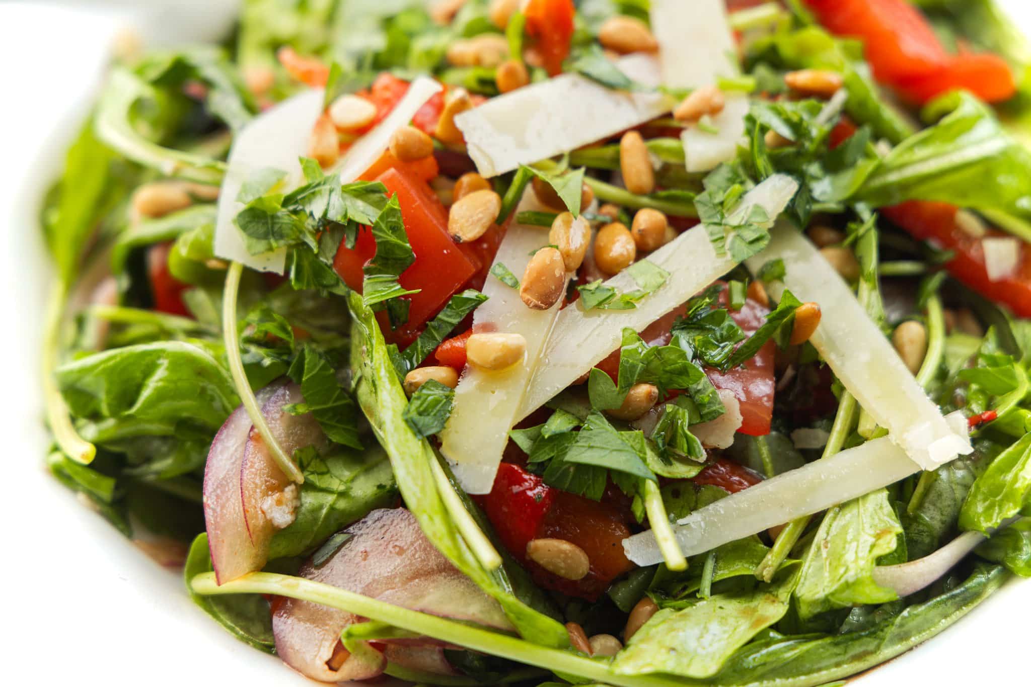 Italian mixed salad topped with toasted pine nuts, fresh parsley, and shaved parmesan cheese.