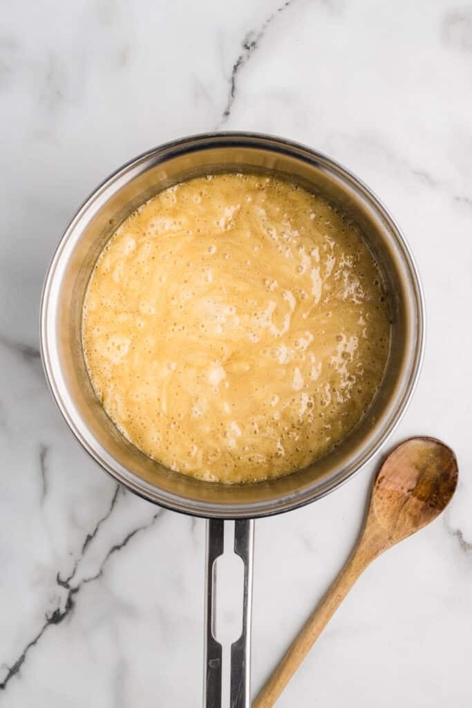 Golden caramel mixture bubbling in a saucepan.